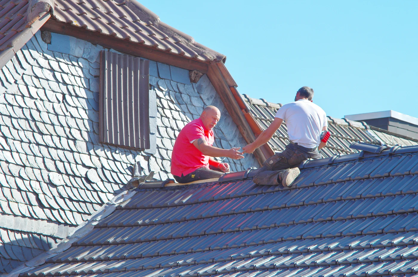 Roofing professional working on a residential roof